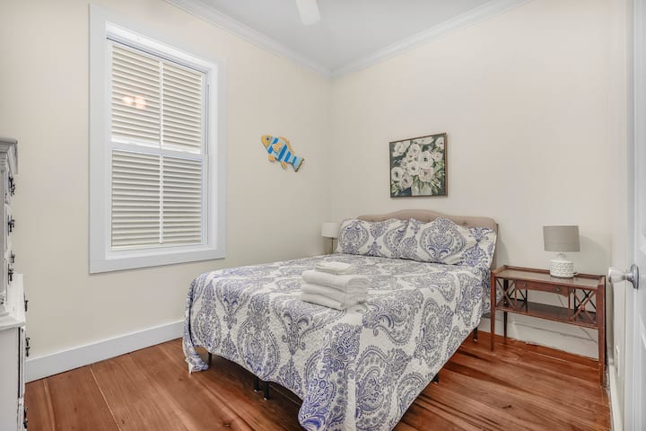 A peaceful retreat after a day in the sun, sink into soft bedding and drift off surrounded by cozy coastal charm.