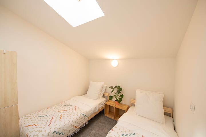 Twin beds. Sky window (blind operated manually).