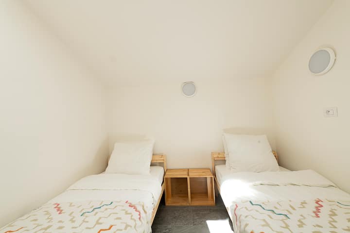 Twin beds. Sky window (blind operated manually).