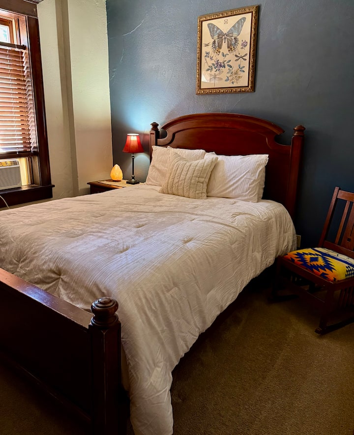 Suite 1 back bedroom with air conditioning, queen bed.  Deck off of back bedroom. 