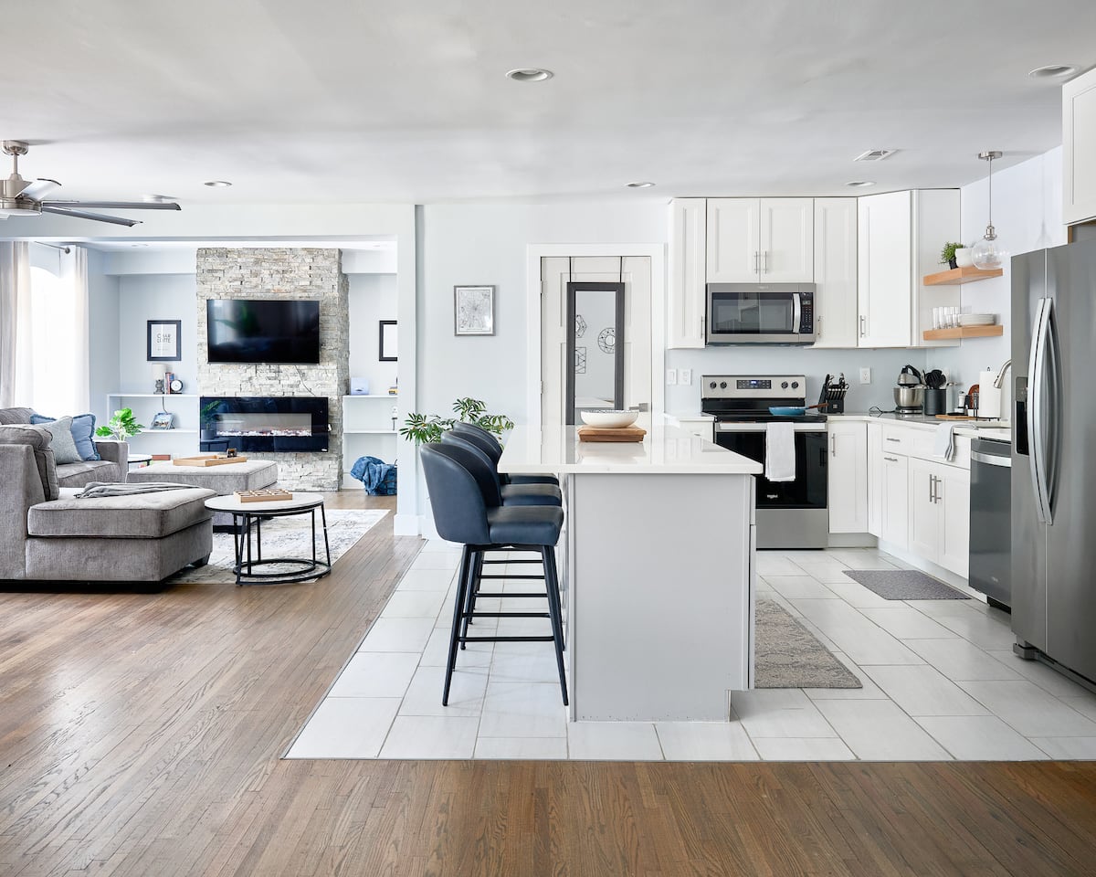 Chef's kitchen with premium appliances and open dining area at Charlotte Modern Retreat