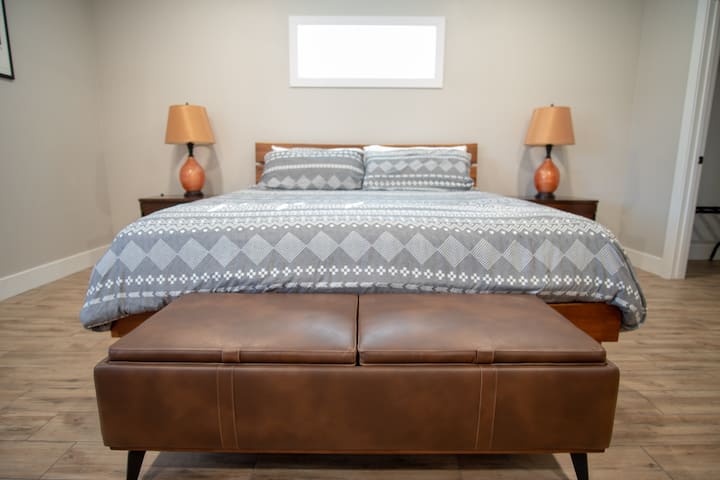 Main downstairs bedroom with king size bed and private en-suite bathroom.