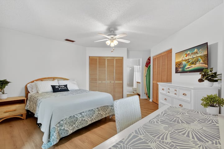 Enjoy a restful night's sleep in the master suite.   This room has new flooring and coastal appeal. 