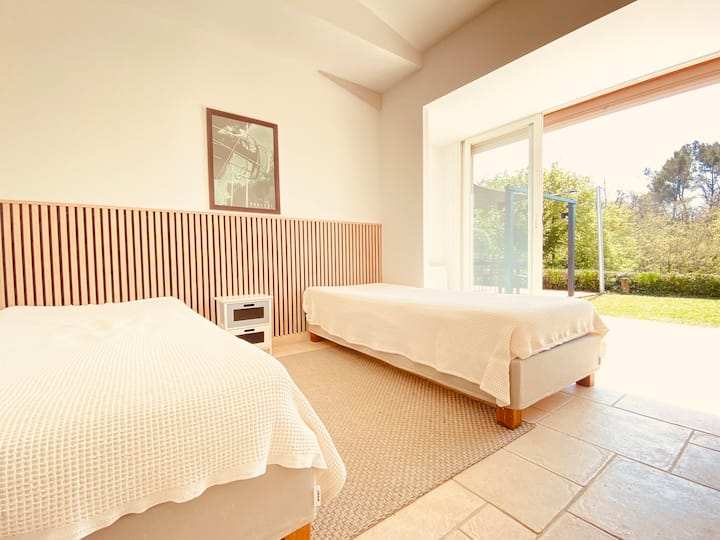 Perfect for children or friends, this bedroom with two double beds offers comfort and space for everyone to find their own cozy space