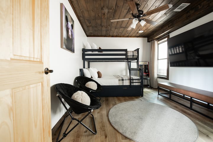 - Bunk bed has full bed, twin top bunk, & twin trundle bed
- Arcade game with Pac-Man, Galaga, etc
- Movie theater-style TV setup!
- 75 inch Samsung Smart TV
- Closet for clothing storage