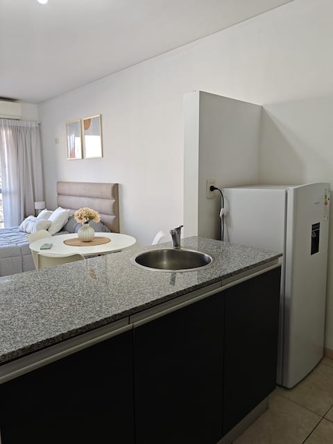 Successful Airbnb property: Spacious studio apartment meters from Boulevard Oroño in Rosario