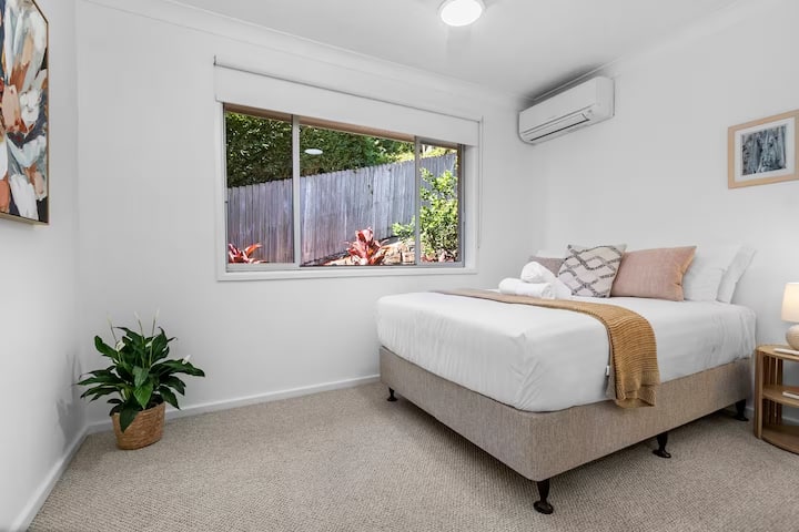 Third bedroom with double bed, wardrobe, ceiling fan and reverse cycle air conditioning.