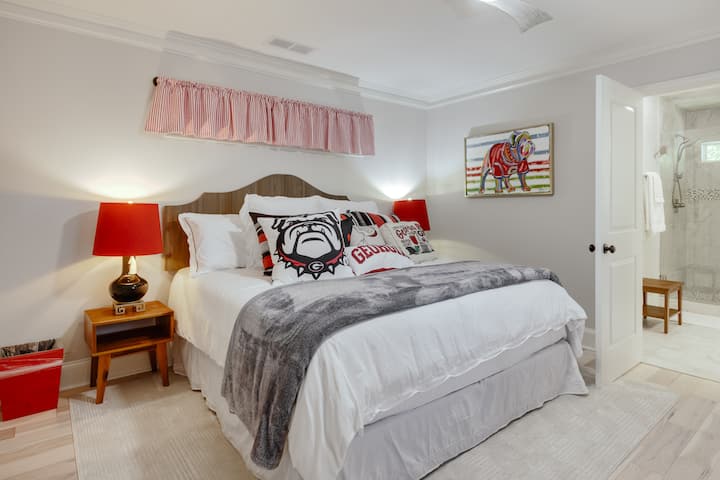 King bed decorated in all Georgia decor
