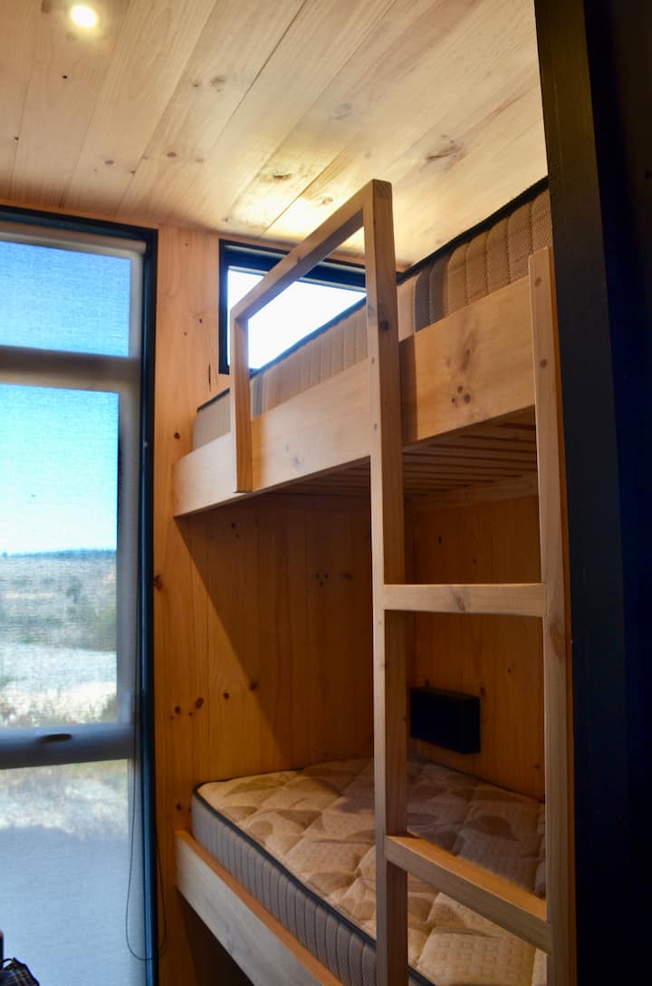 Bedroom with a bunk bed for 2 guests, with Forest View.