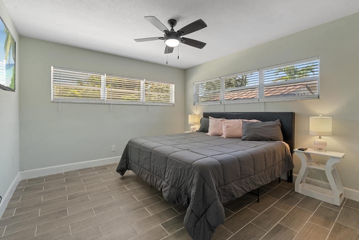 King bedroom with Smart Tv and storage for clothing 