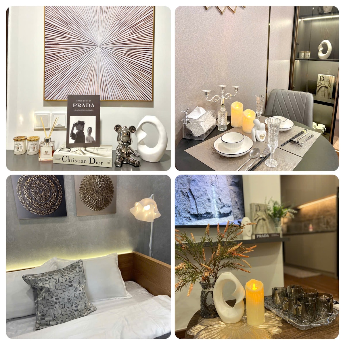 A stylish living space is featured, showcasing a contemporary decor with elegant pieces such as framed art, candles, and decorative items. A dining table is set with fine dishware, while a cozy sleeping area displays a neatly arranged bed with decorative pillows, enhancing the luxury environment.