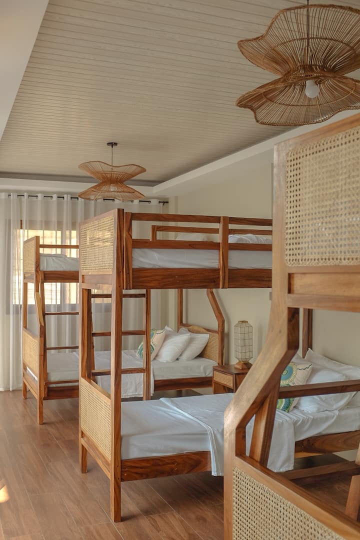 Bedroom 3 featuring three double-sized bunk beds with en-suite toilet and bath with heater.