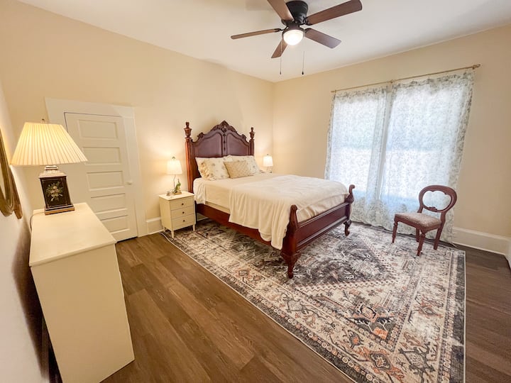 Bedroom 2 features a queen-size bed, two closets, and a desk for a dedicated workspace.