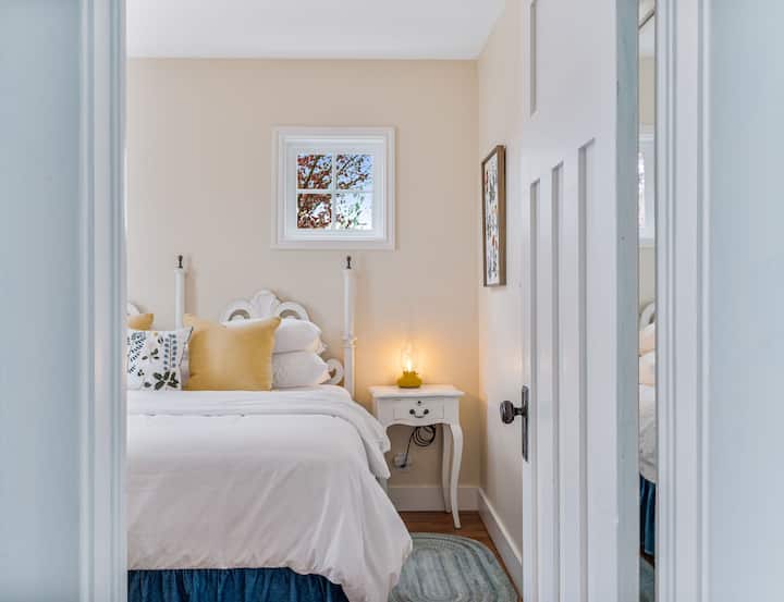 Entering Main Floor Primary with King Bed and attached Bath