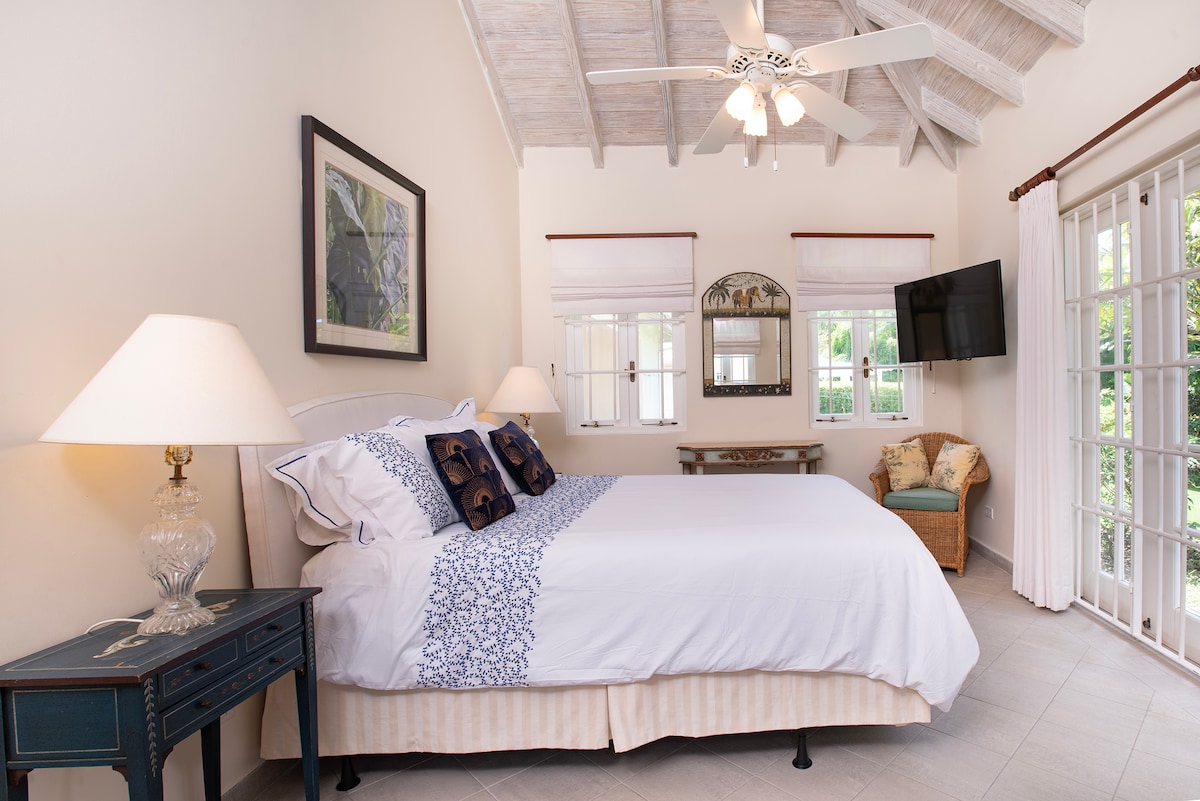 Peaceful bedroom 3 with direct access to the gardens, a UK king size bed, TV and en suite.