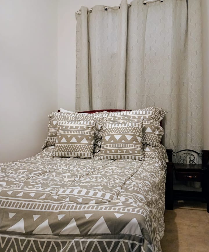 Second bedroom for two people. It has a full private bathroom, a clothes rack, and a clothes organizer for your stay. 2