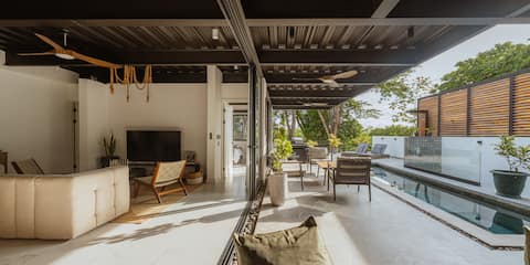 House with pool and cold plunge steps to the beach