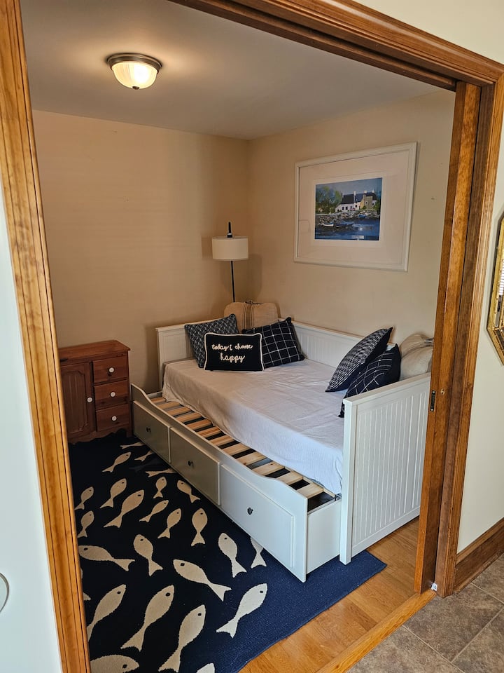 This is a Day Bed which opens to almost a King bed. Pull the lower section out, then slide top mattress over. Extra Linens are in the drawers.