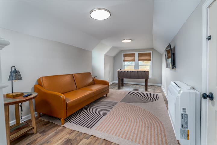Our upstairs loft features a leather futon, a 43 in smart tv. We also have a rollaway single  bed for extra guests. 