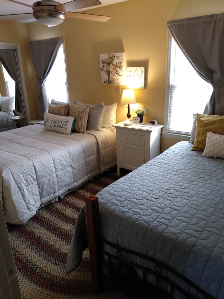 Bedroom has one queen bed and one full bed with mattress topper.  There is a closet with hangers, drawers for clothing and extra blankets.