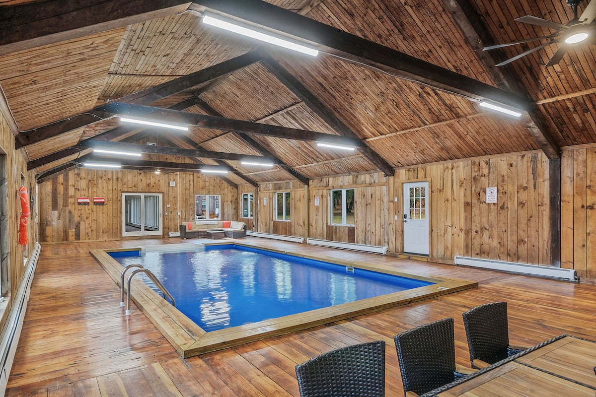Heated indoor pool open year-round at Hudson Valley Estate — Top 5% on Airbnb