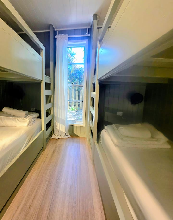 The Bunker
Custom timber bunks with individual fans, lights, and USB ports. Playful, stylish, and perfect for kids.