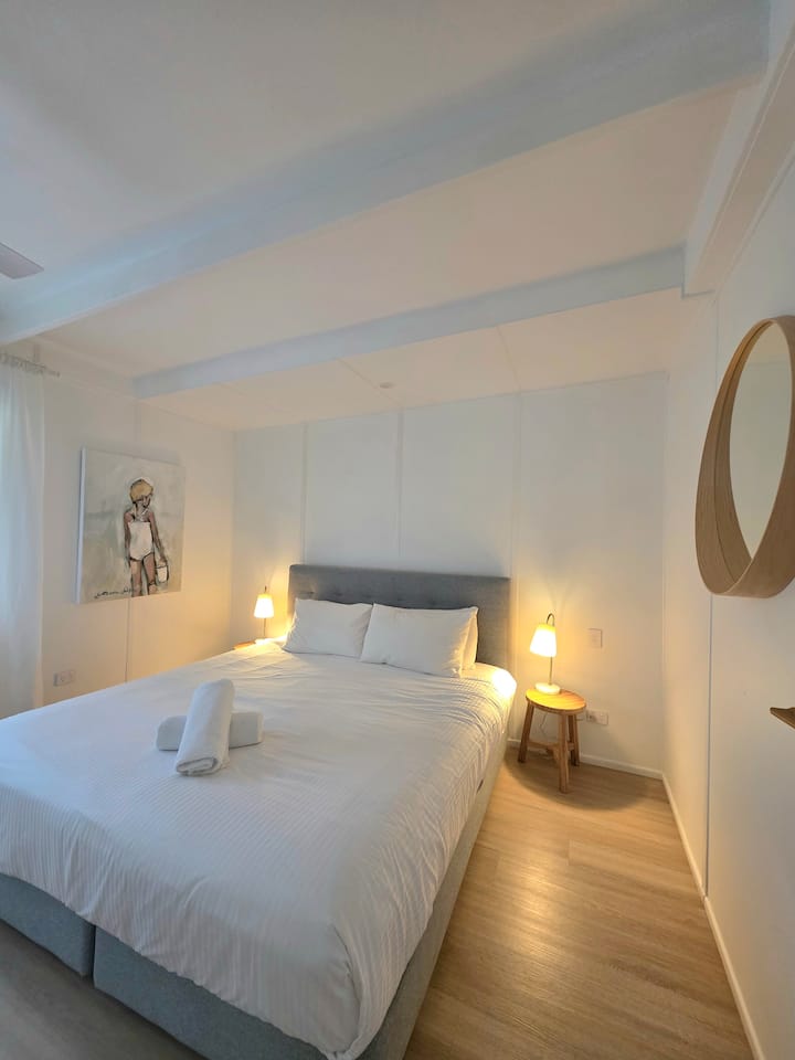 Bedroom 3, The Blue Room.  The Biggest of the downstairs bedrooms. Soft coastal hues, cool and calm.  King Size Bed