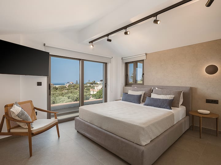 Attic Level: Bedroom 3 with Queen bed, ensuite bathroom, Smart TV,  panoramic sea views