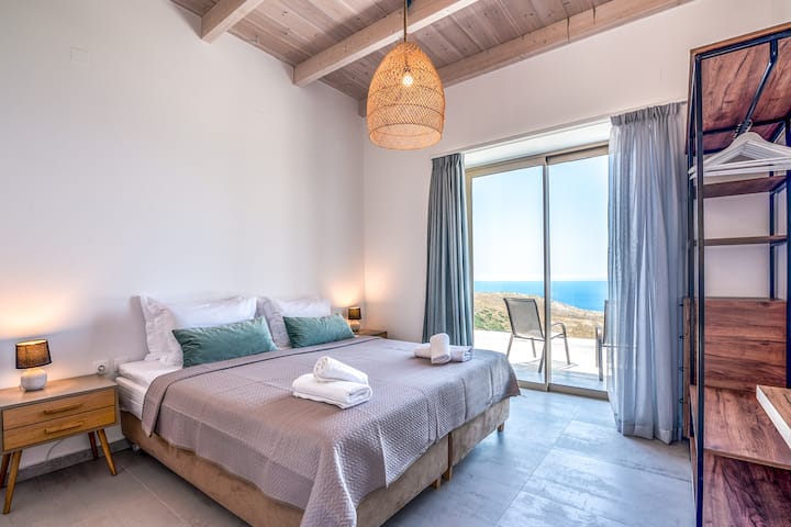 Bedroom 1 with king bed, ensuite bathroom and balcony with sea view