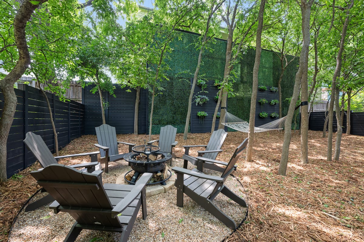 Fire pit in the shaded backyard