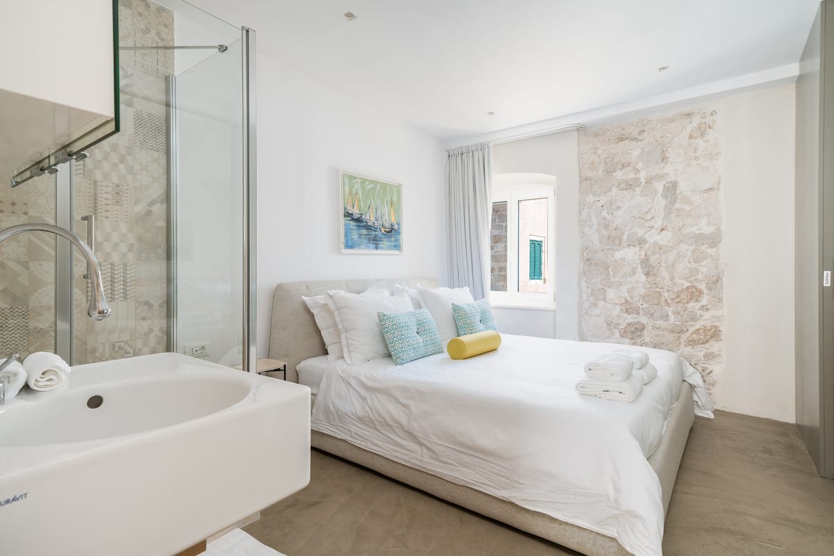 Main bedroom with an Italian king bed at Riva Lavanda