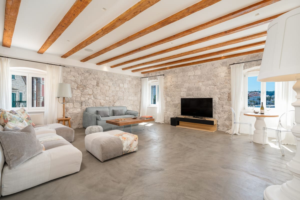 Living space with ancient stone and modern finishes at Riva Lavanda