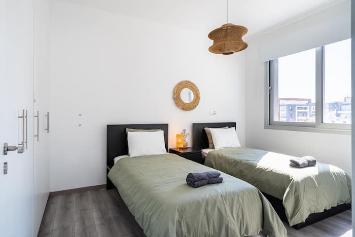 Comfortable one-bedroom with two single beds — ideal for friends, siblings, or solo travelers. Perfect for travel companions who prefer their own space. — rest well, wake refreshed.