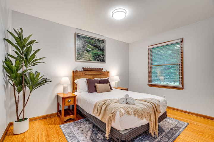 Bedroom 3 offers a peaceful retreat with a cozy double bed, soft lighting, and warm wood accents — the perfect spot to relax and recharge.