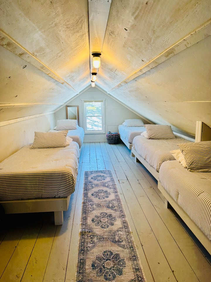 We have 5 twin beds available in east end of the lofted attic area. 