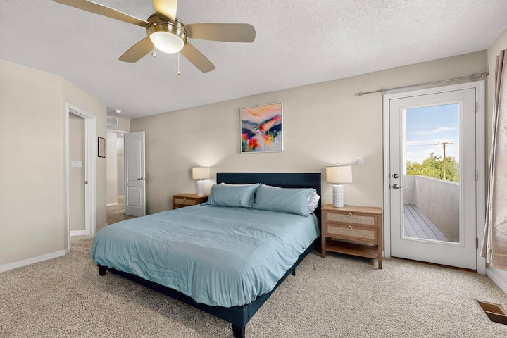 The master bedroom, a king size bed, private west facing balcony for amazing sunset views!