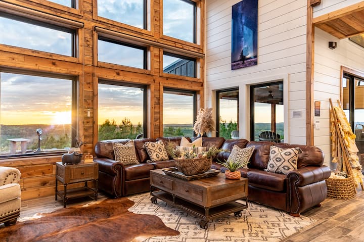 Rustic living room with sunset views and cozy cabin charm