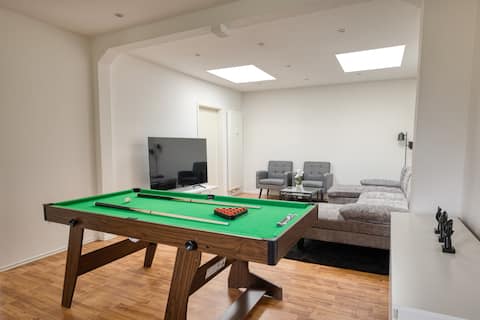 Spacious city loft with billiard table