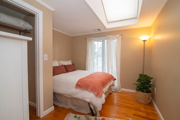 Serene room with queen bed.