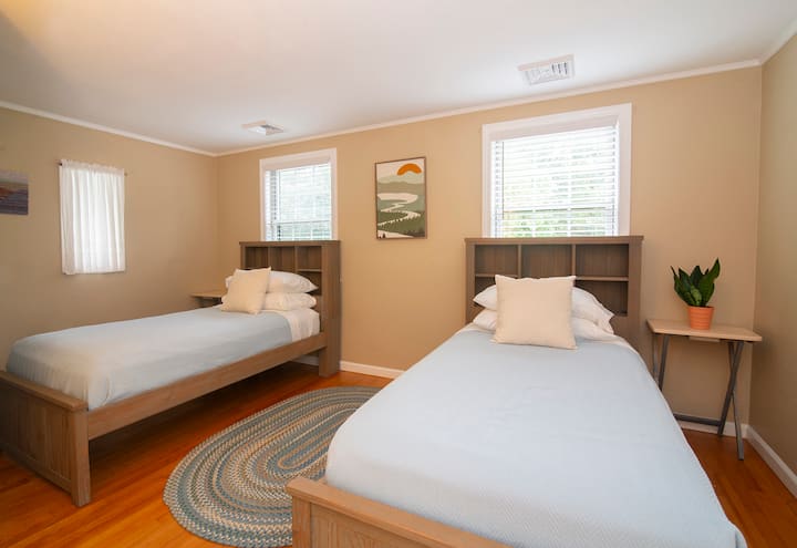 Perfect room for kids with two twin beds and an extra lush twin mattress stored in closet.