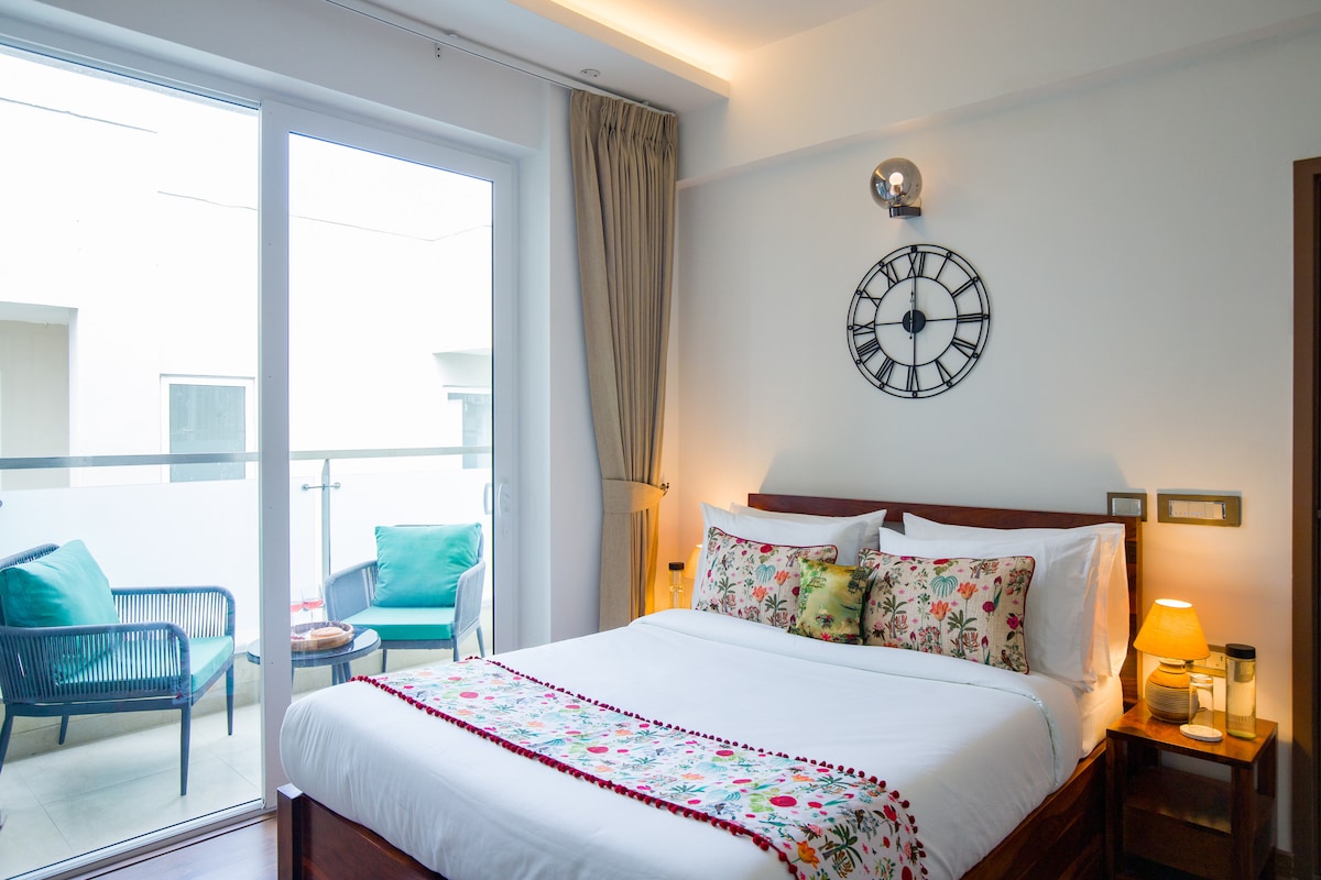 Simple and peaceful room with cozy bedding and thoughtful touches for a restful and private stay.