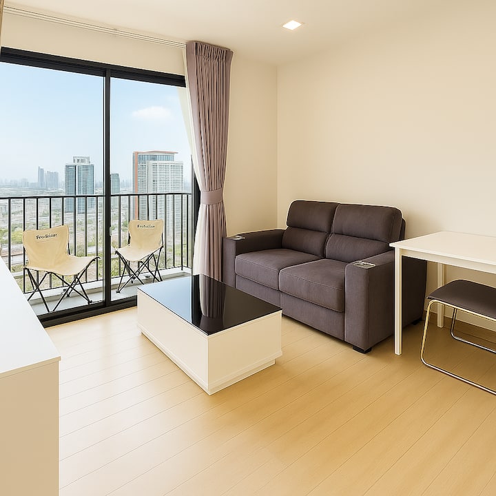 Spacious living room with balcony and chairs in balcony