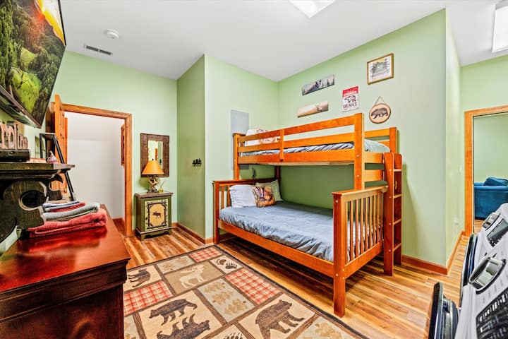 Bedroom #4: Convenient laundry room with extra sleeping space—a bunk bed featuring a full on the bottom and a twin on top.