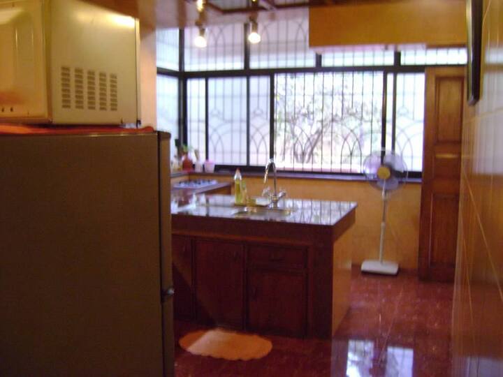 Large Kitchen with a door leading to the Alfresco Dining. Convenient.
