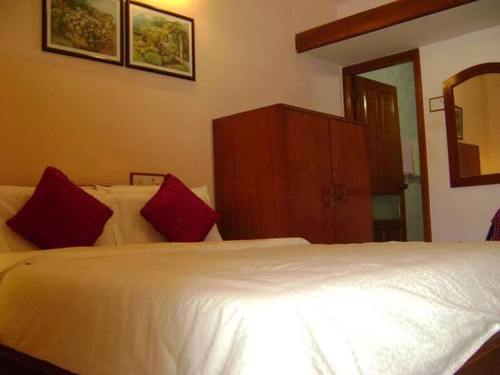 Ensuite Bedroom No. 2, with an attached terrace. Airconditioned. 32 inch Smart TV. Very Comfy Beds with mattress protector and Duvets.