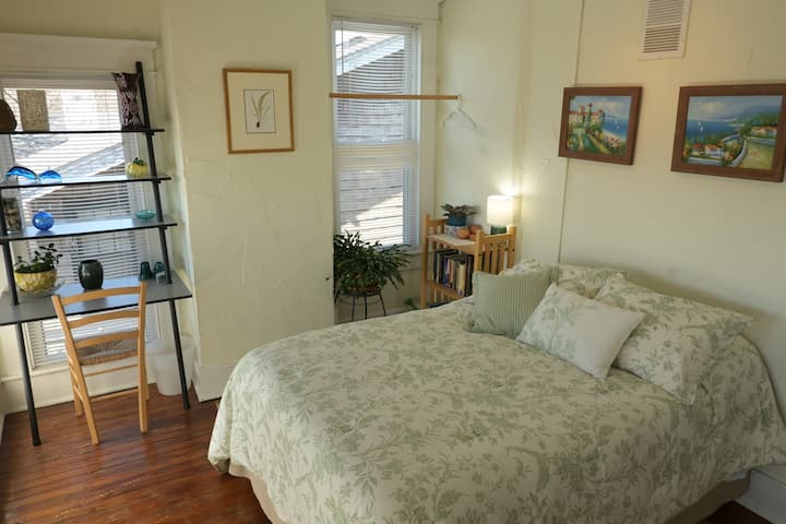 Bedroom A, (nicknamed "The TreeHouse") is bright and cheery and has a lovely bird's eye view of the backyard and neighborhood. There is also a dedicated workspace in this bedroom making it an introvert's dream.
