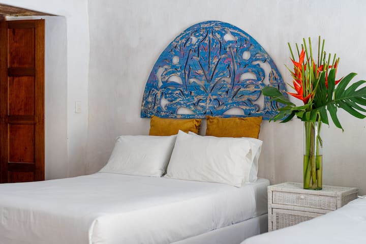 Bedroom 4. Enjoy two double beds, private bathroom & air conditioning. Located in the first floor.
