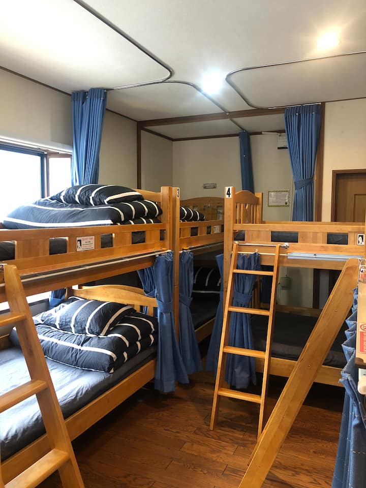 SHARED Dormitory Room "B". Accommodates a maximum of 10 guests. Each bunk has its own reading light and power outlet.