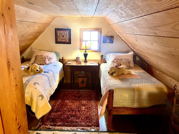 Upstairs attic bedroom- a children's favorite, with secret balcony looking down into the kitchen.