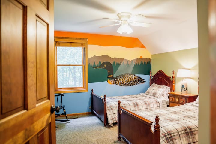 This is our Loon Lounge, located upstairs featuring two twin beds and ceiling fan. Check out our SWEET murals - Hand-painted by the fabulous Andy Bablo from Steez Design. His work is all over New Hampshire and Massachusetts.